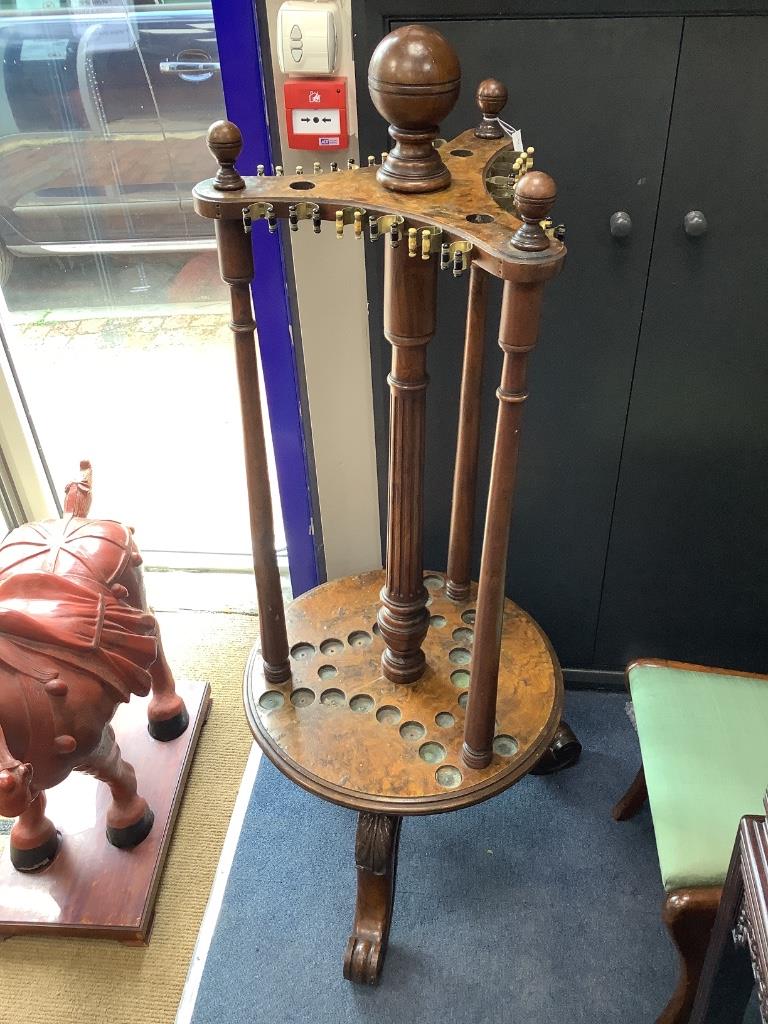 A Victorian walnut and burr walnut revolving billiard cue stand, diameter 56cm height 144cm